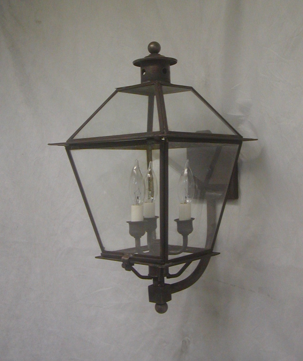 Genie House Lighting 91421DBC Kojan Three Light Wall Mount Outdoor Brass