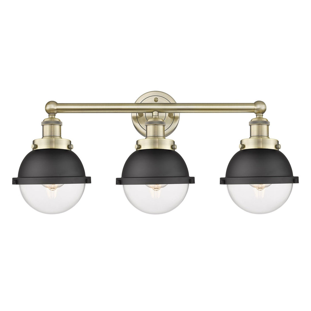 Innovations Downtown Urban 616-3W-AB-HFS-62-BK Bath Vanity Light 26 in. wide - Antique Brass