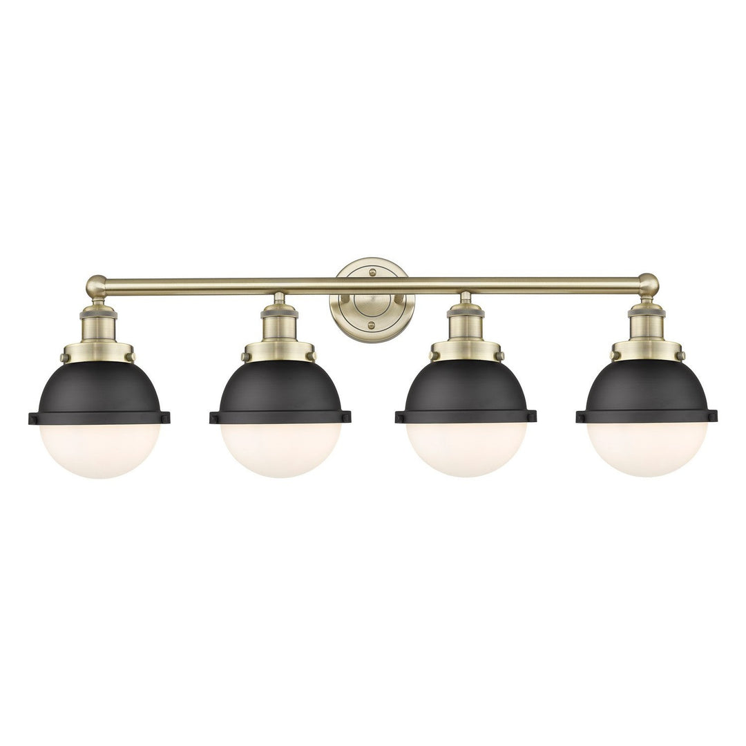 Innovations Downtown Urban 616-4W-AB-HFS-61-BK Bath Vanity Light 35 in. wide - Antique Brass