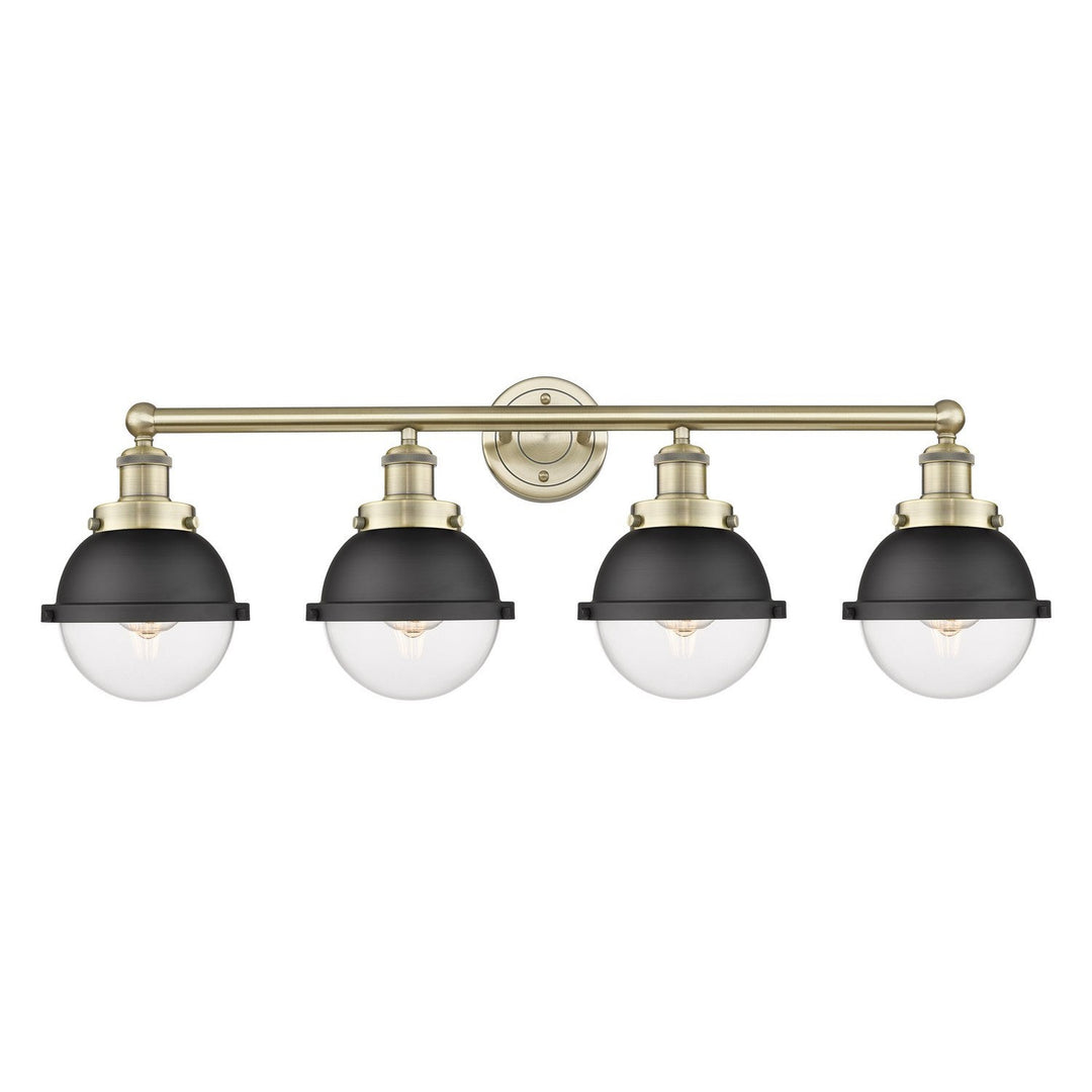 Innovations Downtown Urban 616-4W-AB-HFS-62-BK Bath Vanity Light 35 in. wide - Antique Brass