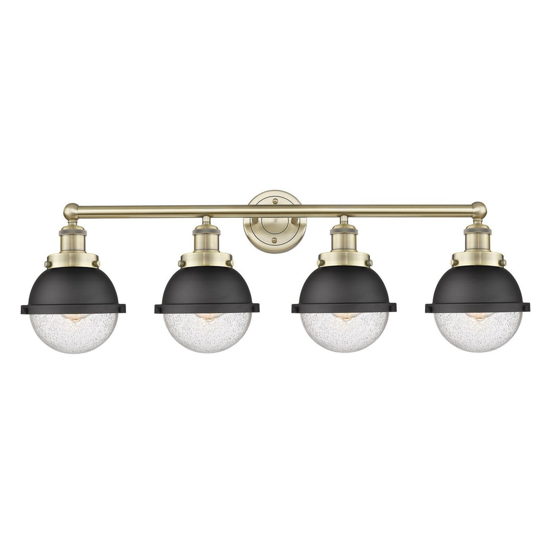 Innovations Downtown Urban 616-4W-AB-HFS-64-BK Bath Vanity Light 35 in. wide - Antique Brass